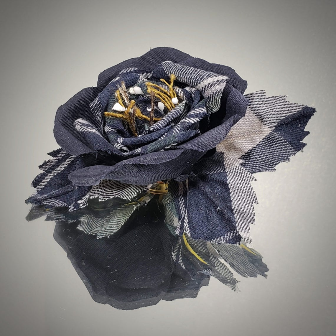 Fabric flower brooch with three leaves